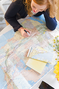 Young woman planning road trip 