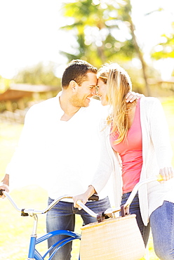 Couple riding on bikes, Jupiter, Florida