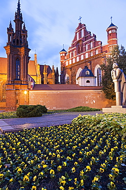 Saint Ann and Bernardine Churches at evening, flowers in foreground, Lithuania