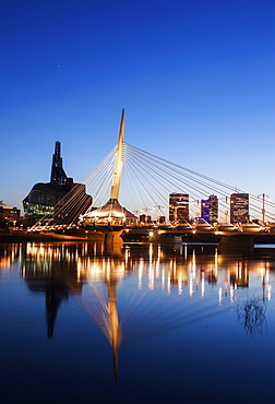 Canadian Museum for Human Rights and Esplanade Riel bridge at dusk, Winnipeg Manitoba, Canada