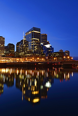 Waterfront reflecting in Channel at dusk, Boston, Massachusetts