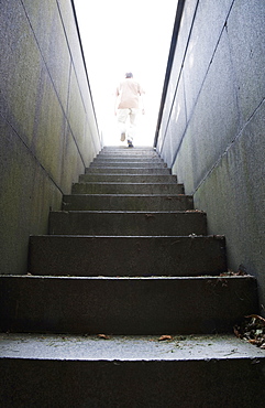 Man at top of stone stairway, Boston, Massachusetts