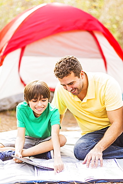 Father and son (12-13) camping, Jupiter, Florida