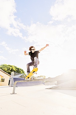 Man skateboarding in skatepark, West Palm Beach, Florida