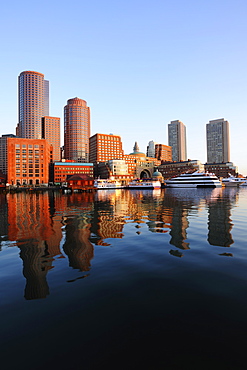 Symmetrical view of architecture reflecting in water, Boston Waterfront, Boston, Massachusetts 
