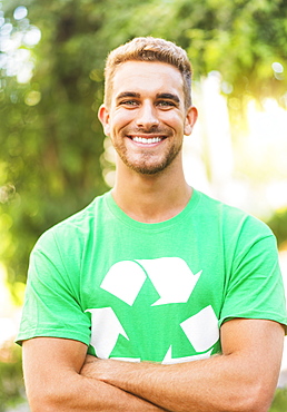 Portrait of young man wearing t-shirt with recycling symbol