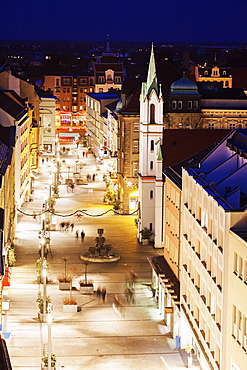 Illuminated old town street with tower of Schlosskirche, Germany, Brandenburg, Cottbus, Schlosskirche