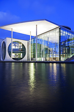 Riverfront parliament office building illuminated at dusk, Germany, Berlin, Federal Parliament Offices