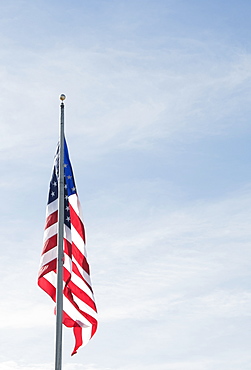 American flag against blue sky