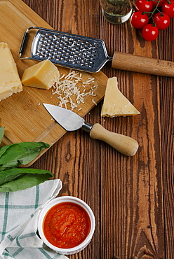 Pizza ingredients on wooden table