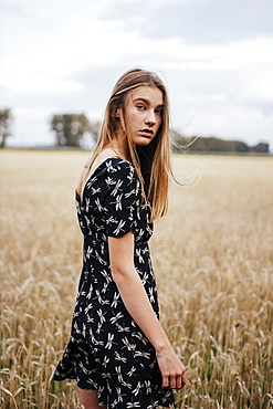 Young woman in wheat field