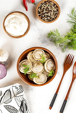 Dumplings in bowl with dill