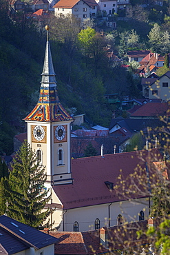 Church with clock tower in Brasov, Romania