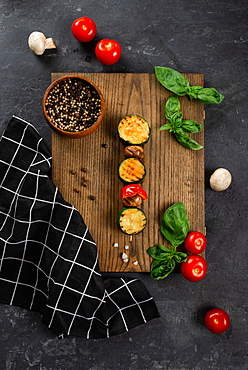 Grilled mushroom and courgette skewer on cutting board