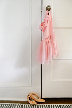 Pink ballet tutu hanging on doorknob