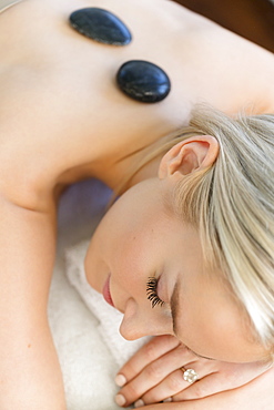 Woman enjoying hot stone massage