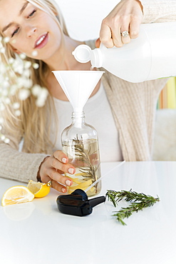 Woman making a homemade natural cleaner