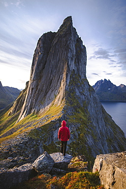 Norway, Senja, Man standing in front of Segla mountain at sunrise