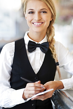 Portrait of smiling waitress