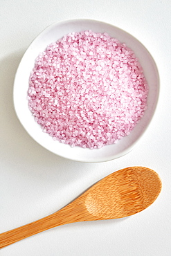 Bath salt in bowl and wooden spoon