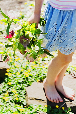 Girl holding bouquet of flowers