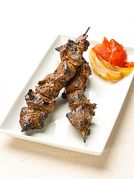 Steak kabob on plate