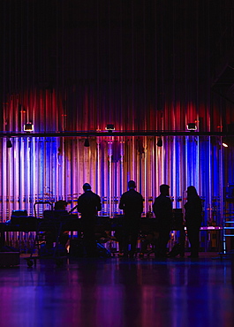 Silhouettes of musicians backstage