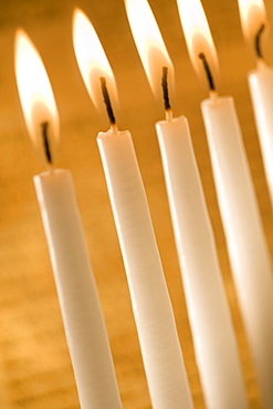 Candles burning in a menorah