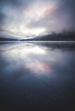 Austria, Plansee, Lake Plansee in fog at sunrise in Austrian Alps