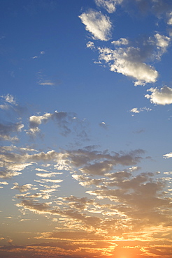 Sunset with puffy clouds