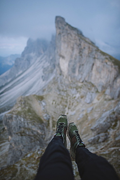 Italy, Dolomite Alps, Seceda mountain, Low section of man near Seceda mountain in Dolomites