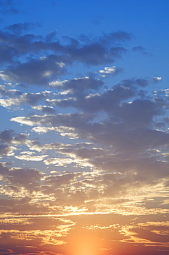 Sunset with puffy clouds