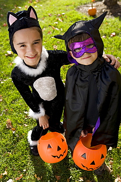 Boy and girl in Halloween costumes