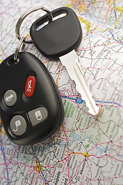 Closeup of car keys and map