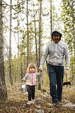 Father with daughter (2-3) walking in forest, Wasatch-Cache National Forest