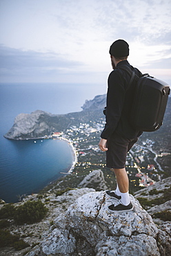 Italy, Liguria, La Spezia, Man looking at mountain range from mountain top