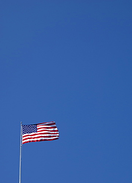 American flag against blue sky