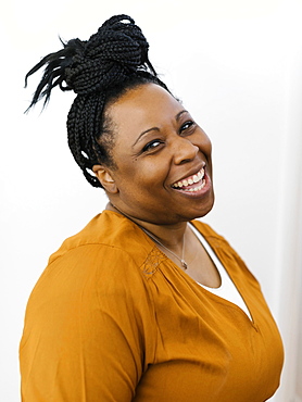 Portrait of smiling woman with black braided hair
