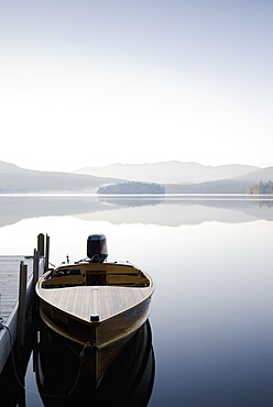 USA, New York, Lake Placid, Motorboat docked on lake