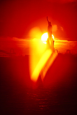 United States, New York, New York, Silhouette of Statue of Liberty at sunset