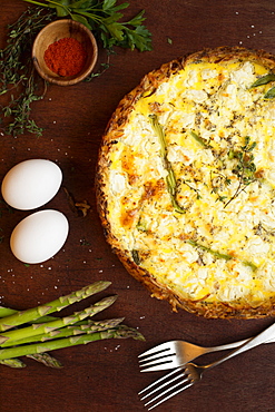 Quiche with ingredients of eggs, asparagus, paprika and thyme