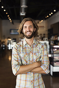 Portrait of mid adult man in coffee shop