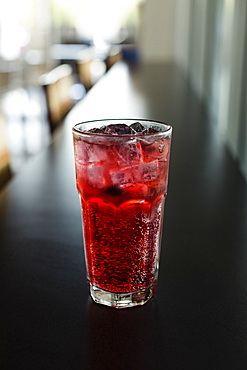 Mixed berry sparkling tea on coffee shop counter