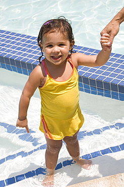 Girl standing in swimming pool