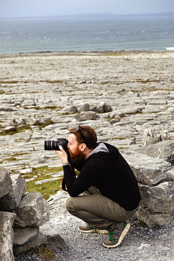 Man taking photograph, The Burren, County Clare, Ireland