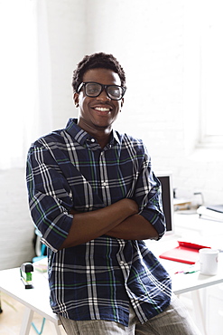 Portrait of young man wearing checked shirt