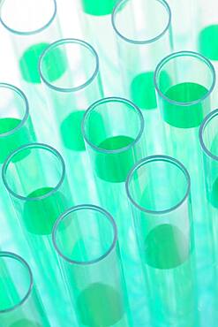 Close-up of test tubes with green liquid