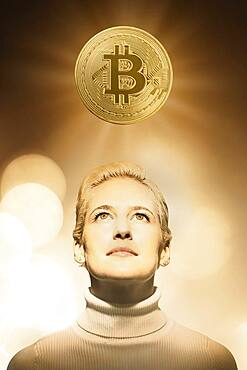 Woman with bitcoin over head