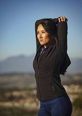 Woman stretching in landscape