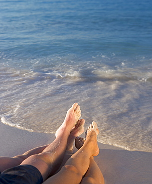 Couple relaxing on beach